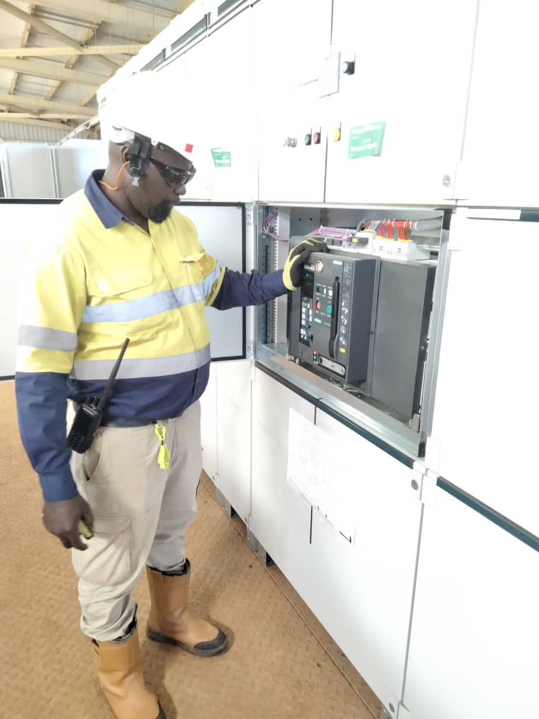 Technician working on a circuit breaker